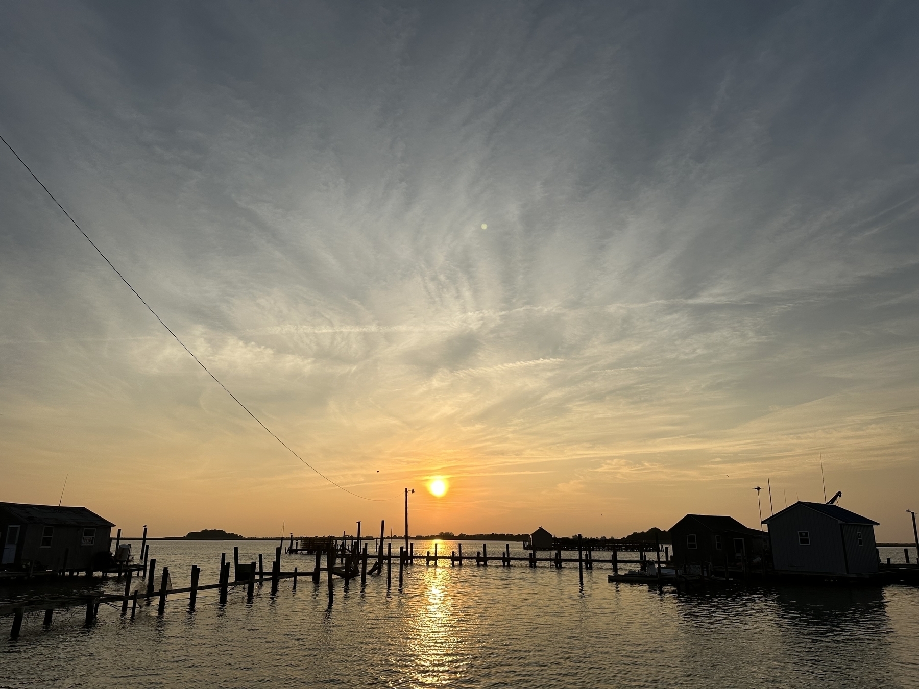 Photo of a sunset over the town docks. 